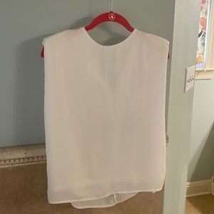 White body sleeveless blouse with shoulder pads